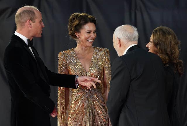 The Duke and Duchess of Cambridge are greeted by Barbara Broccoli (right) and Michael G. Wilson (second right)  (Jonathan Brady/PA)