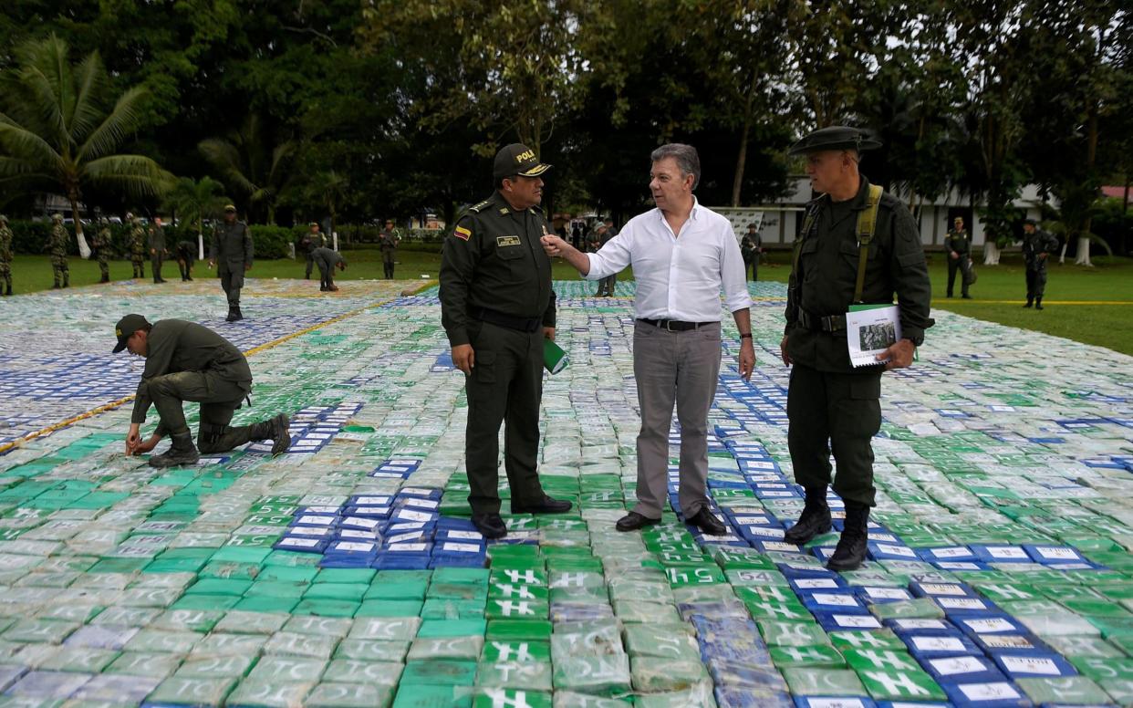 Colombia's President Juan Manuel Santos looks on after the seizure of more than 12 tons of cocaine in Apartado, Colombia - REUTERS