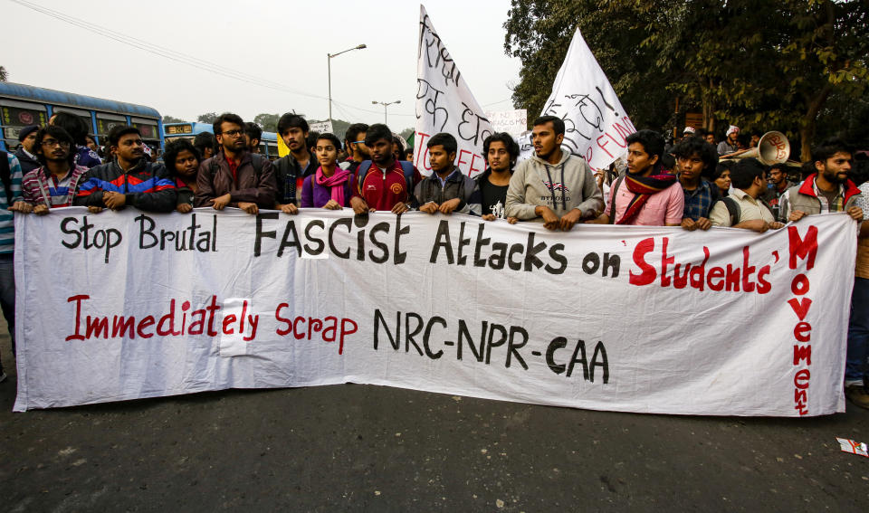 Indian students participate in a protest rally against the Citizenship Amendment Act, in Kolkata, India, Saturday, Dec. 21, 2019. Critics have slammed the law as a violation of India's secular constitution and have called it the latest effort by the Modi government to marginalize the country's 200 million Muslims. Modi has defended the law as a humanitarian gesture. (AP Photo/Bikas Das)