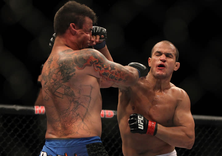 LAS VEGAS, NV - MAY 26: (R-L) Junior dos Santos punches Frank Mir during the Heavyweight Championship bout at UFC 146 at MGM Grand Garden Arena on May 26, 2012 in Las Vegas, Nevada.