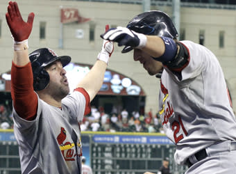 Allen Craig (right) is greeted by Cardinals teammate Nick Punto after hitting a three-run homer in a 13-6 win over the Astros on Tuesday