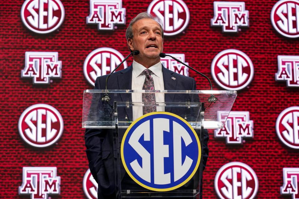 Texas A&M coach Jimbo Fisher shown on the stage during SEC Media Days at the College Football Hall of Fame in Atlanta.