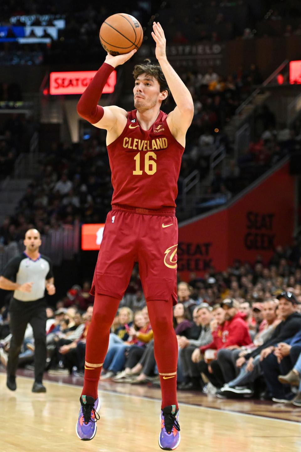 Cleveland Cavaliers forward Cedi Osman shoots a 3-point basket during the second half of an NBA basketball game against the Utah Jazz, Monday, Dec. 19, 2022, in Cleveland. (AP Photo/Nick Cammett)