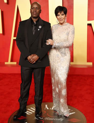<p>MICHAEL TRAN/AFP via Getty</p> Corey Gamble and Kris Jenner glam up for the 2024 Vanity Fair Oscars afterparty