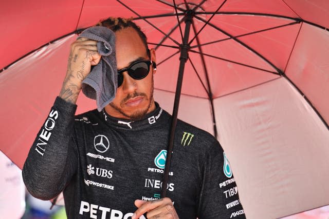 Lewis Hamilton wipes his forehead