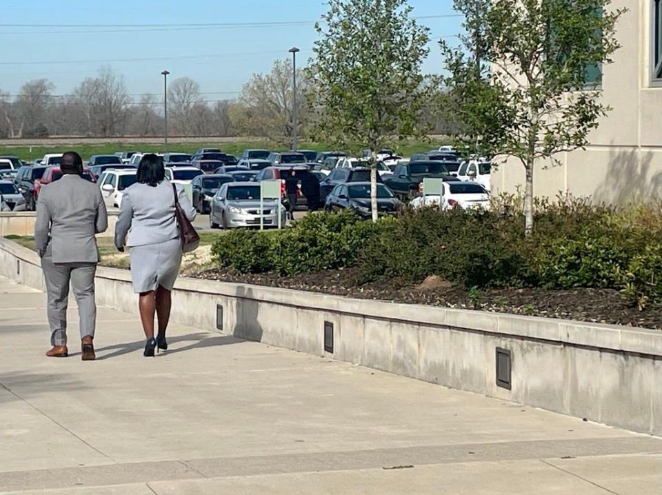 Caddo Commissioner Steven Jackson and Attorney Courtney N. Harris walking out of the Bossier Parish Courthouse after his arraignment Tuesday morning. Feb. 28, 2023.