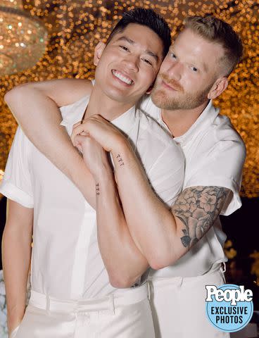 <p>HEATHER KINCAID PHOTOGRAPHER</p> Mark Manio (left) and Scott Hoying celebrate at their wedding reception.