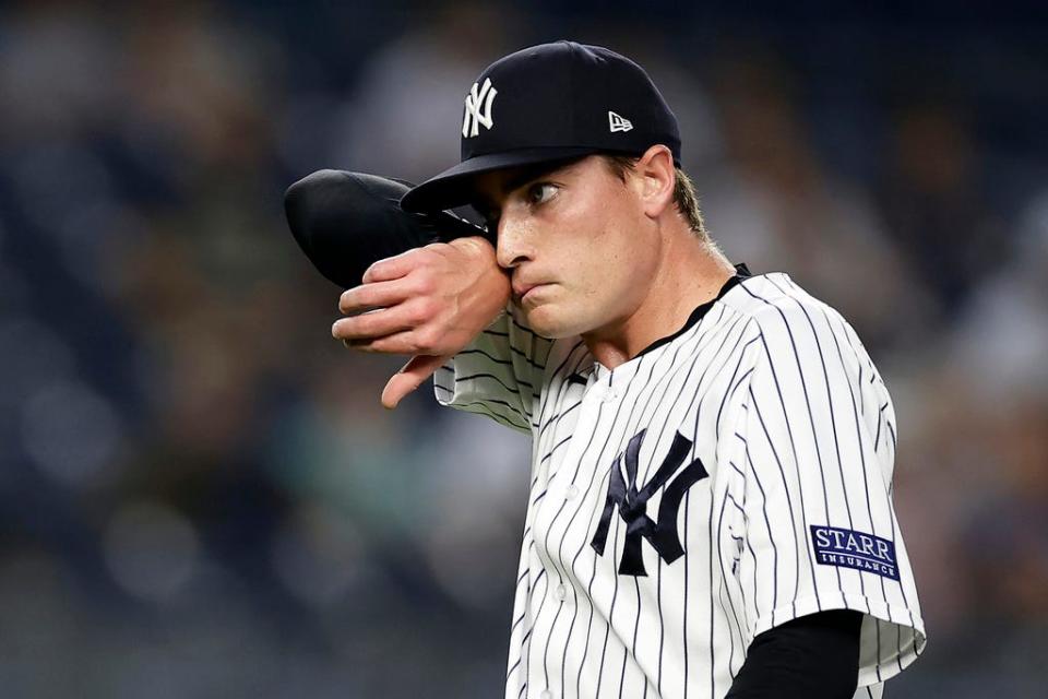 New York Yankees pitcher Ron Marinaccio reacts during the ninth inning of a baseball game against the Milwaukee Brewers, Saturday, Sept. 9, 2023, in New York.