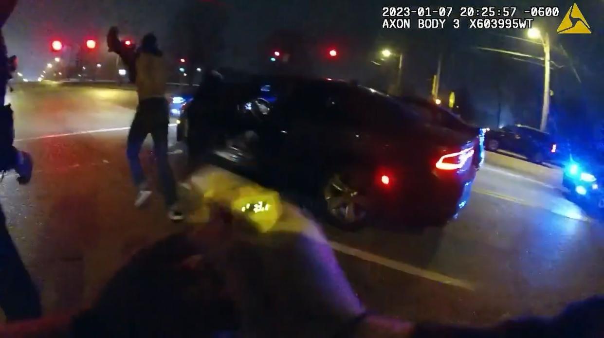 A frame grab from video made available by the city of Memphis shows Tyre Nichols, left, 29, during a traffic stop
