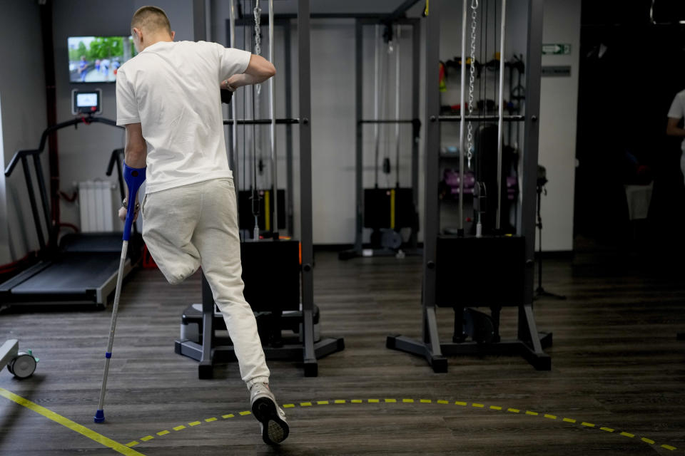 "Buffalo" trains his new prosthetic limb at a clinic in Kyiv, Ukraine, Friday, June 17, 2022. "Buffalo" is among the wounded survivors that were evacuated during the last-ditch defense of the Azovstal steel mill after exploding 120mm mortar rounds tore apart his left leg, Buffalo says: "The absence of a leg is a challenge, not a problem'. (AP Photo/Natacha Pisarenko)