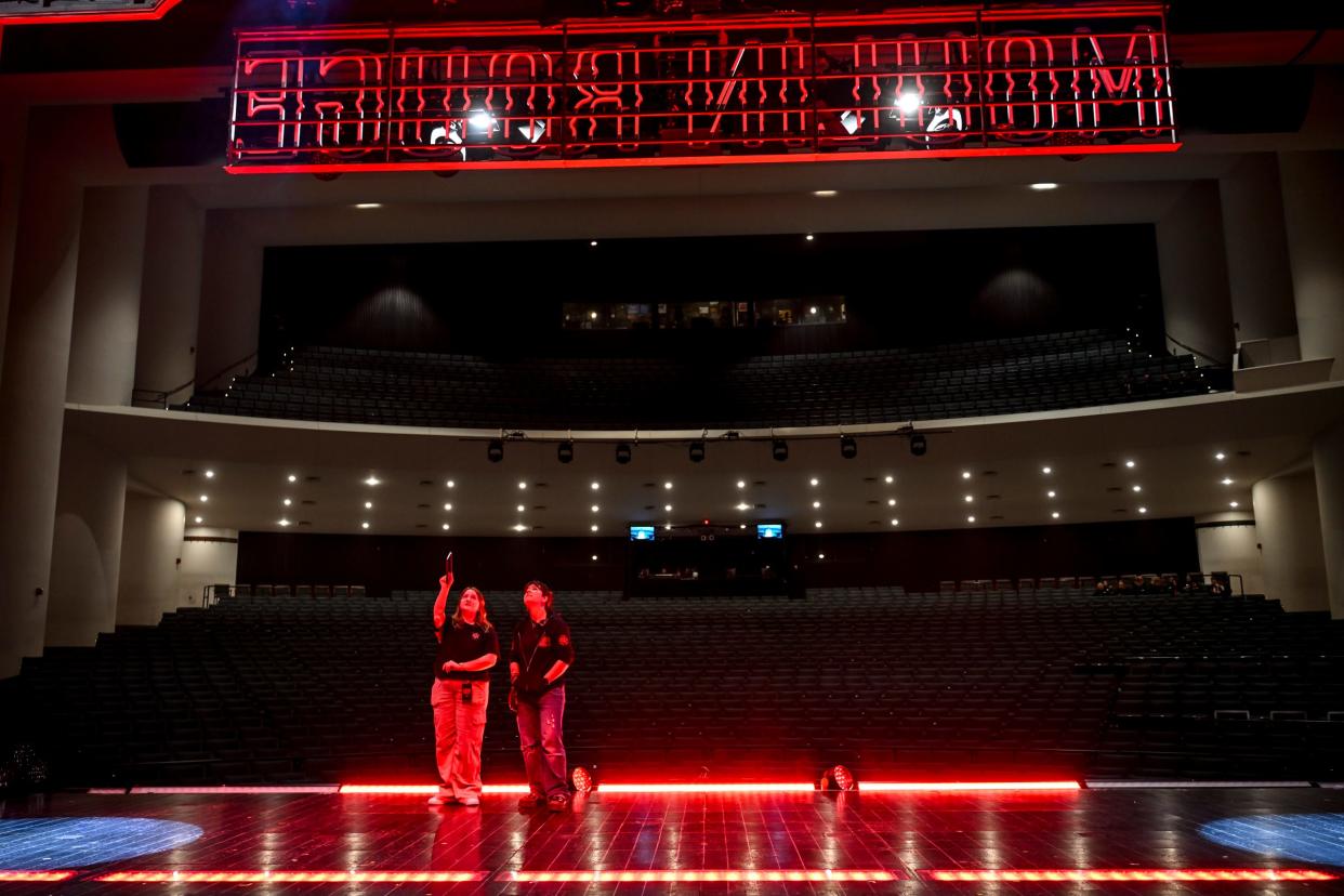 Members of the crew test out the stage lights before a performance of the musical "Moulin Rouge" on Wednesday, April 10, 2024, at the Wharton Center in East Lansing.