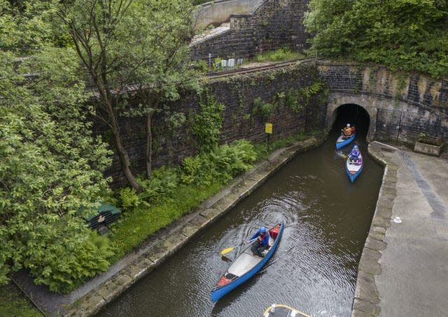 Canoeists exit the Standedge Tunnel on the Huddersfield Narrow Canal, described as one of the seven wonders of Britain’s waterways 