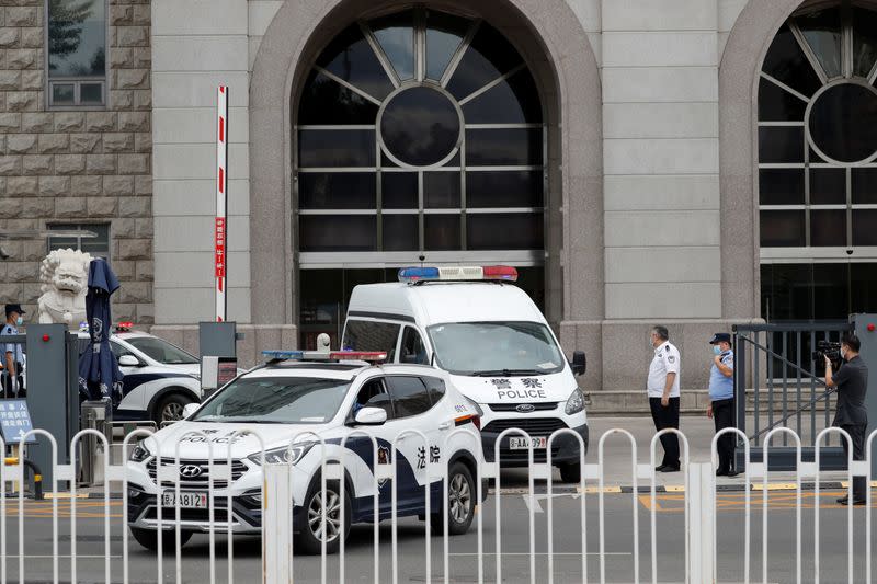 Police van leaves Beijing No. 2 Intermediate People's Court