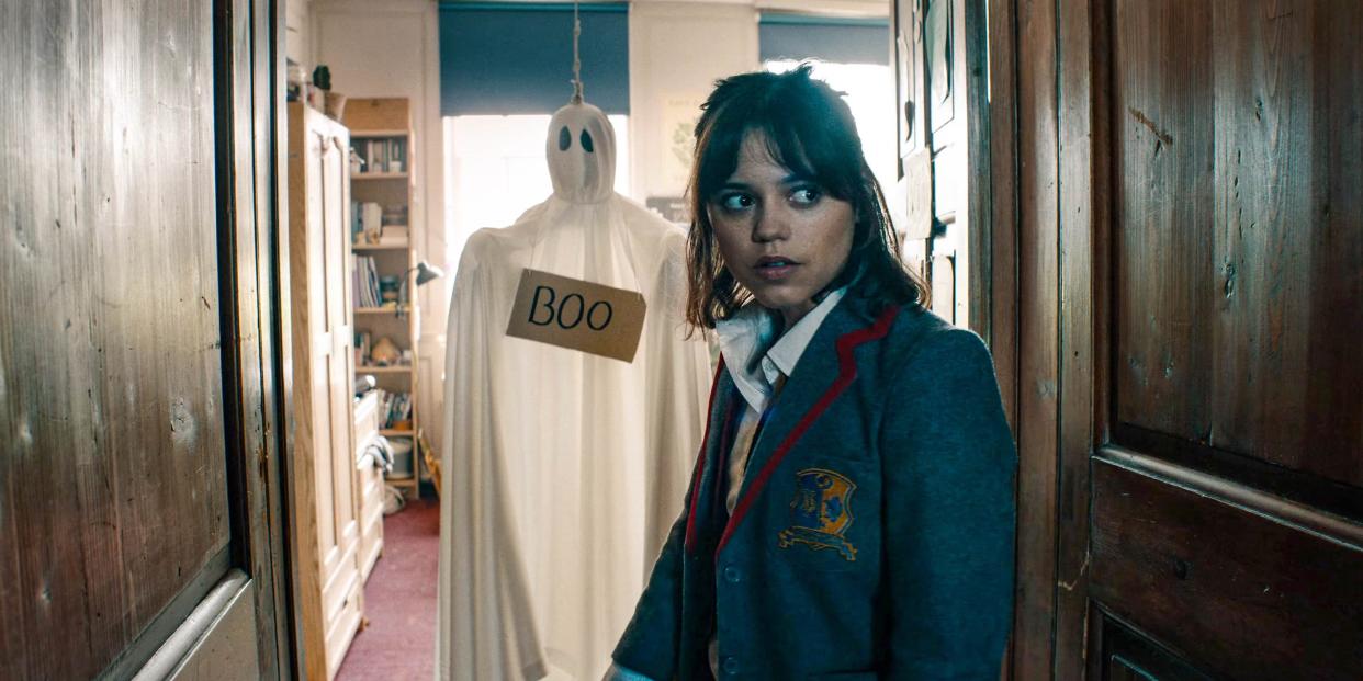 Jenna Ortega with a ghost behind her