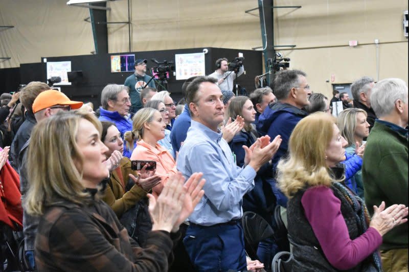 Iowa Republican caucus-goers applaud entrepreneur Vivek Ramaswamy during a speech in Clive on Monday. Photo by Joe Fisher/UPI