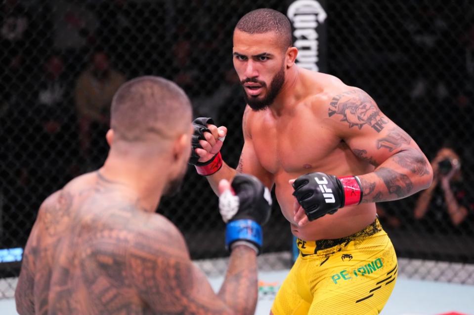 LAS VEGAS, NEVADA – MARCH 02: (R-L) Vitor Petrino of Brazil battles Tyson Pedro of Australia in a light heavyweight bout during the UFC Fight Night event at UFC APEX on March 02, 2024 in Las Vegas, Nevada. (Photo by Jeff Bottari/Zuffa LLC via Getty Images)