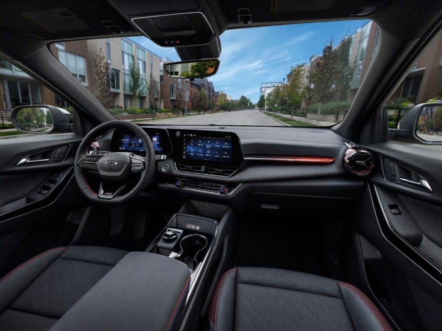 View of front cabin in the 2025 Chevrolet Equinox RS in Radiant Red Tintcoat. Preproduction model shown. Actual production model may vary. Model year 2025 Chevrolet Equinox available 2024.