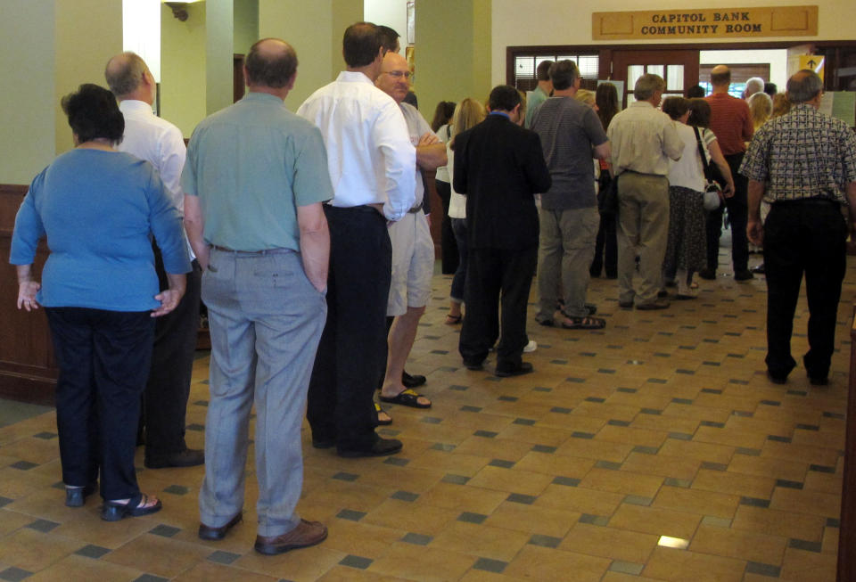 Voters line up at a polling place Tuesday, June 5, 2012, in Madison, Wis. Wisconsin Republican Gov. Scott Walker faces Democratic challenger Tom Barrett in a special recall election. (AP Photo/Scott Bauer)