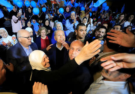 Bahiya al-Hariri, Lebanese MP and sister of Lebanon's former Prime Minister Rafik al-Hariri, gestures as she greets a supporter during a campaign rally in Sidon, Lebanon April 22, 2018. Picture taken April 22, 2018. REUTERS/Jamal Saidi