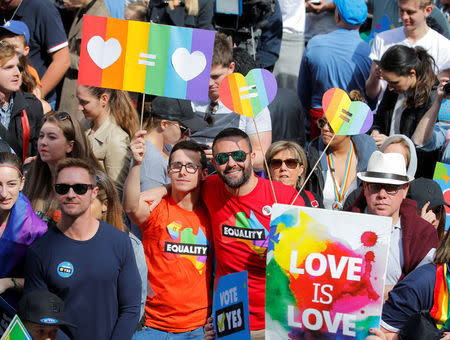 A couple attends a rally for marriage equality of same-sex couples in Sydney, Australia, September 10, 2017. REUTERS/Jason Reed