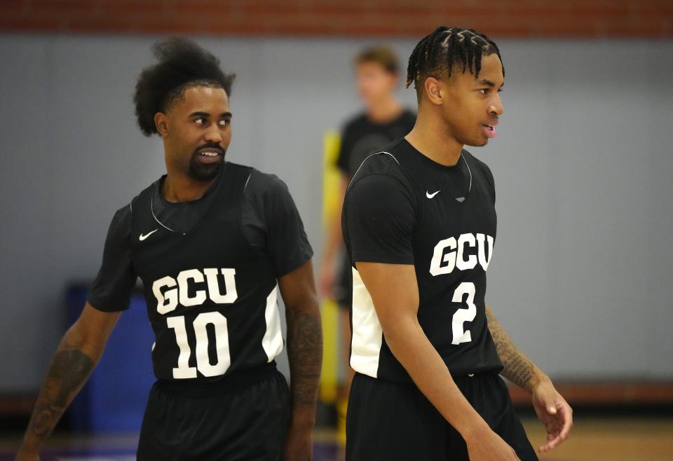 September 27, 2022; Phoenix, Ariz; USA; GCU guard Jovan Blacksher Jr. (10) and Chance McMillian (2) watch coaches during a practice at GCUs practice court. Mandatory Credit: Patrick Breen-Arizona Republic