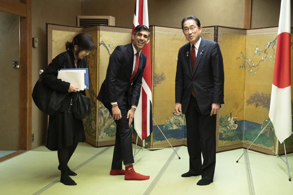 XFP British Prime Minister Rishi Sunak shows off his socks to Japanese Prime Minister Fumio Kishida, which has the name of Kishida's favorite baseball team, Hiroshima Toyo Carp, on them, during their bilateral meeting in Hiroshima ahead of the G7 Summit in Japan, Thursday May 18, 2023. (Stefan Rousseau, Pool via AP)