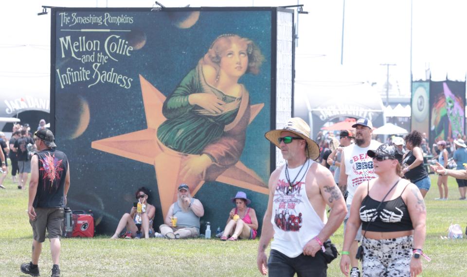 Fans stroll the infield at Daytona International Speedway as Welcome to Rockville opens its four-day run in Daytona Beach. Many fans on Thursday were there to see KISS, out on the band's farewell tour.