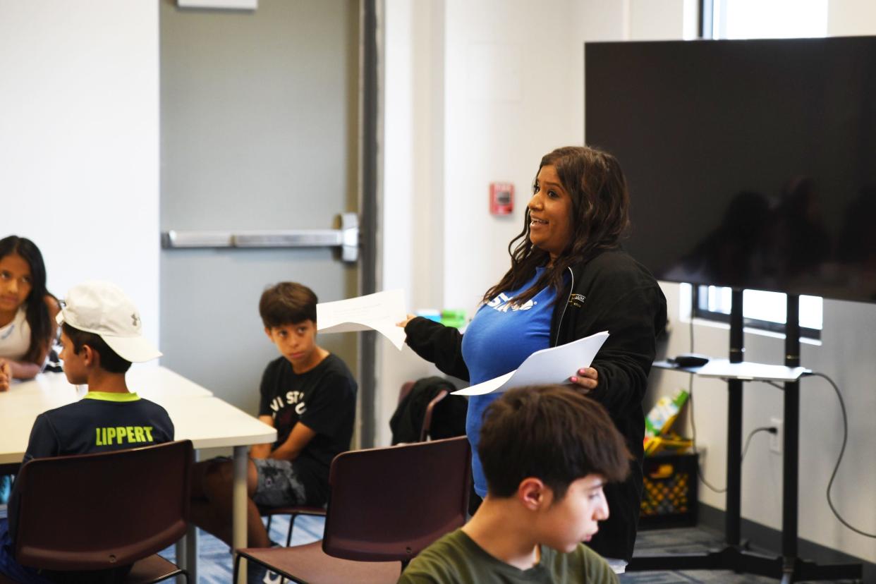 Gladys Rosas speaks in the summer camp for middle school students at at La Casa de Amistad in South Bend, where she works, on Monday July 31, 2023.