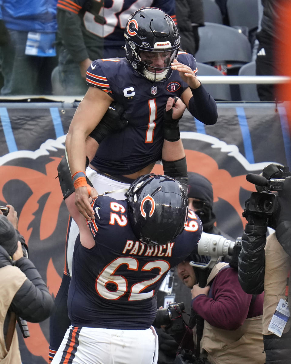 Chicago Bears guard Lucas Patrick lifts quarterback Justin Fields into the air after Fields' rushing touchdown during the second half of an NFL football game against the Detroit Lions Sunday, Dec. 10, 2023, in Chicago. (AP Photo/Erin Hooley)