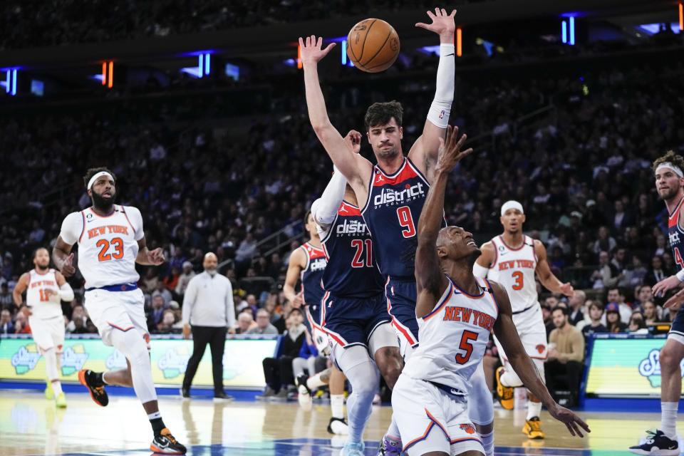 Washington Wizards' Deni Avdija (9) defends a shot by New York Knicks' Immanuel Quickley (5) during the first half of an NBA basketball game Sunday, April 2, 2023, in New York. (AP Photo/Frank Franklin II)