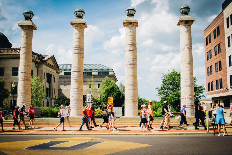 Protesters march near the Boone County Courthouse on Saturday afternoon. 