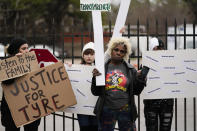 A group of demonstrators protest outside a police precinct in response to the death of Tyre Nichols, who died after being beaten by Memphis police officers, in Memphis, Tenn., Sunday, Jan. 29, 2023. (AP Photo/Gerald Herbert)