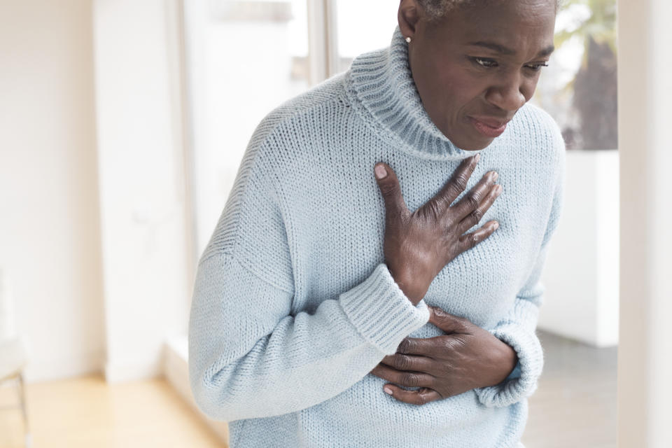 Women can experience different heart attack symptoms than men. (Image via Getty Images)