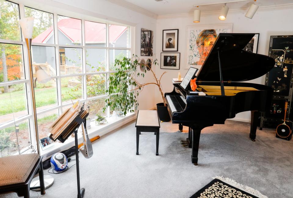 The music room has a baby grand piano that Larry Shapin will often play to relax.