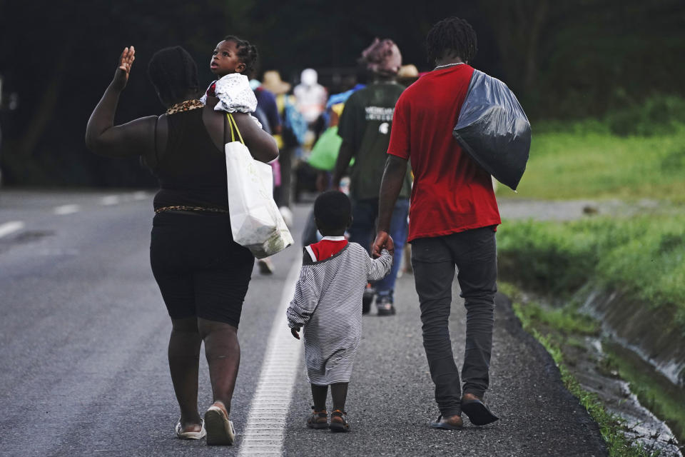 Haitian migrants walk along the highway in Huixtla, Chiapas state, Mexico, early Thursday, Sept. 2, 2021, in their journey north toward the U.S. (AP Photo/Marco Ugarte)