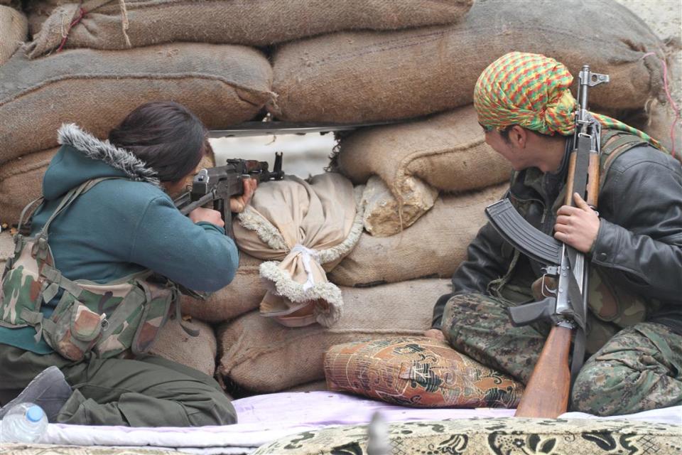 Two fighters defending Kobani during the battle for Kobani, Syria, in Sept. 2014.<span class="copyright">Courtesy Mustafa Alali</span>