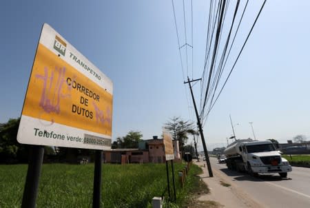 A tanker truck is seen next an area of Petrobras pipelines near the Capivari community in Duque de Caxias