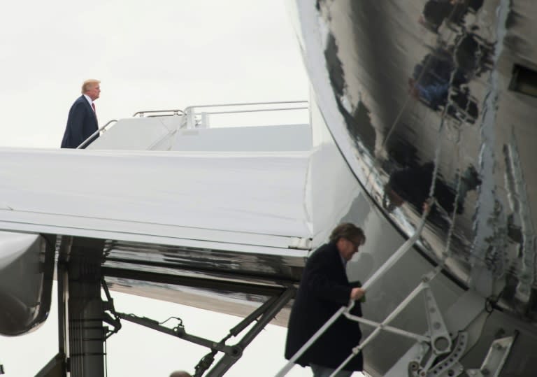 US President Donald Trump (L) and then top aide Steve Bannon -- shown boarding Air Force One in March 2017 -- are now in open war with each other