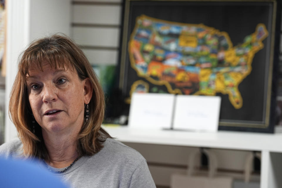 Sally Otto, owner of a downtown craft collective, speaks Tuesday, May 21, 2024, in Greeley, Colo. (AP Photo/David Zalubowski)