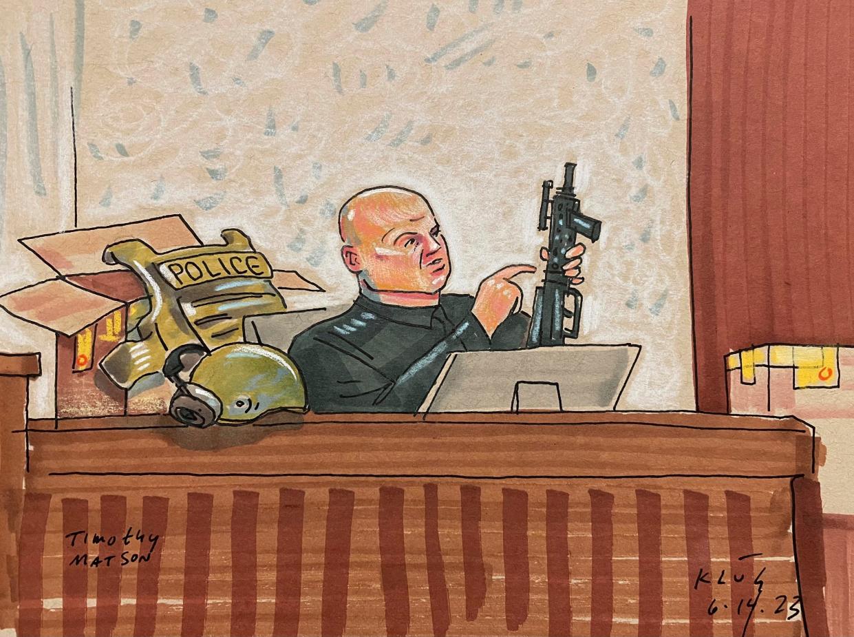 In this courtroom sketch, Pittsburgh SWAT Officer Timothy Matson, who was critically wounded while responding to the rampage, testifies, Wednesday, June 14, 2023, in Pittsburgh, in the federal trial of Robert Bowers. Bowers is accused of shooting to death 11 worshippers in a synagogue more than four years ago, the deadliest antisemitic attack in U.S. history.