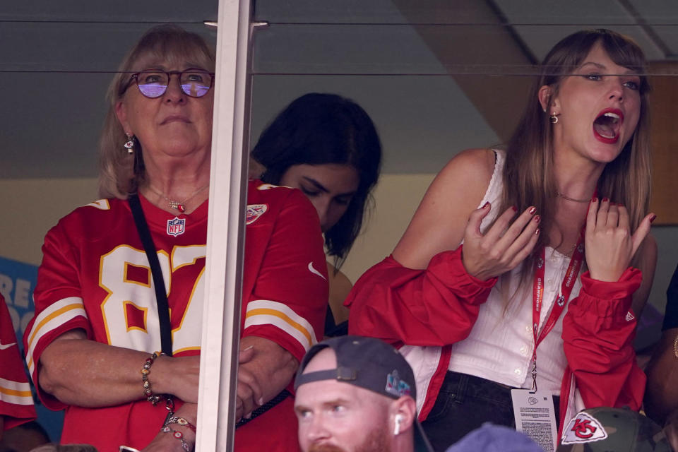 Image: Taylor Swift watches the Kansas City Chiefs game with Donna Kelce, left, the mom of Chiefs tight end Travis Kelce, on Sunday. (Ed Zurga / AP)