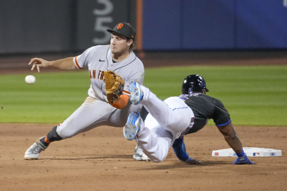 San Francisco Giants shortstop Casey Schmitt, left, waits for the throw before tagging out New York Mets' Starling Marte on an attempted steal of second during the ninth inning of a baseball game Friday, June 30, 2023, in New York. (AP Photo/Mary Altaffer)