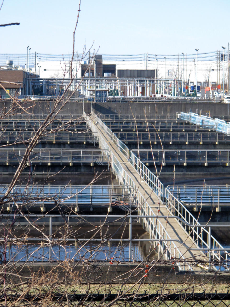 This Wednesday, Jan. 11, 2022 photo shows part of the Passaic Valley Sewerage Authority plant in Newark N.J. A proposed backup power plant for the facility is drawing strenuous opposition from residents who say their neighborhood is already overburdened with polluting facilities, including two other power plants. (AP Photo/Wayne Parry)