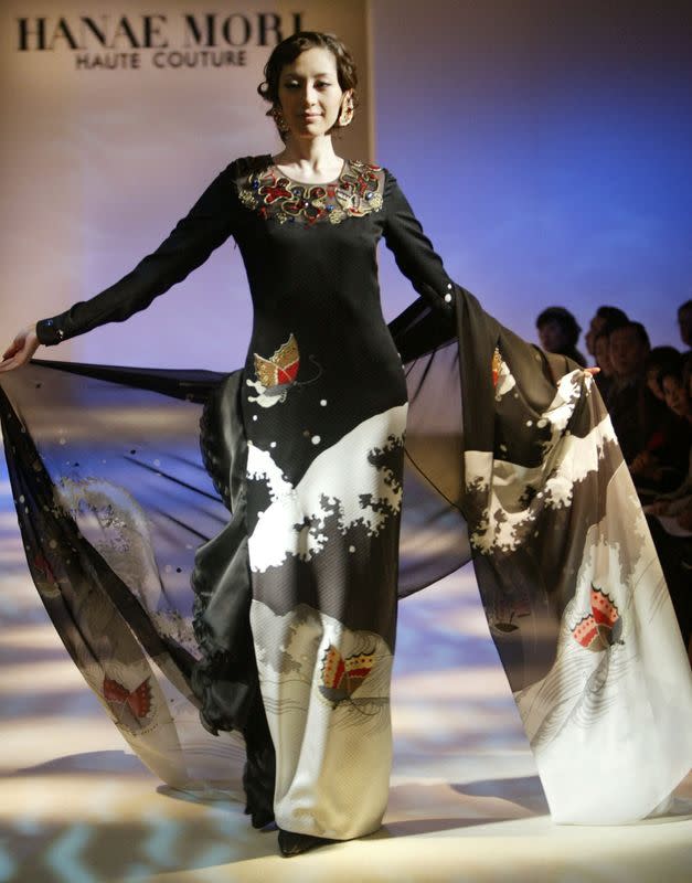 FILE PHOTO: A model wears an outfit by Japanese fashion designer Hanae Mori during her Spring/Summer 2003 show in Tokyo