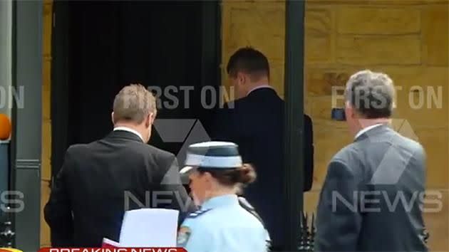 Police raiding player manager's office. Pic: Channel 7