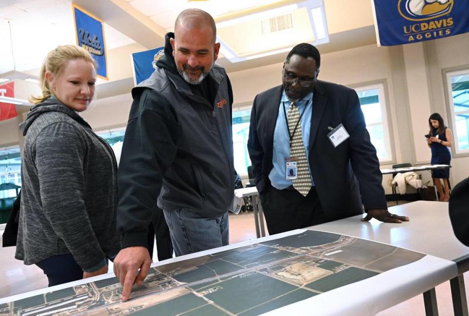 Riverdale resident Lawrence Simas, center, points to a satelllite image of State Route 41 as he discusses the Excelsior Expressway plan with Caltrans Project Manager Ellery Ellis, right, during an open house held by Caltrans Thursday evening, March 23, 2023 in Riverdale. The widening of 41 between Excelsior and Elkhorn avenues will proceed with state transportation official support following a campaign for the 7.1-mile stretch near Riverdale.