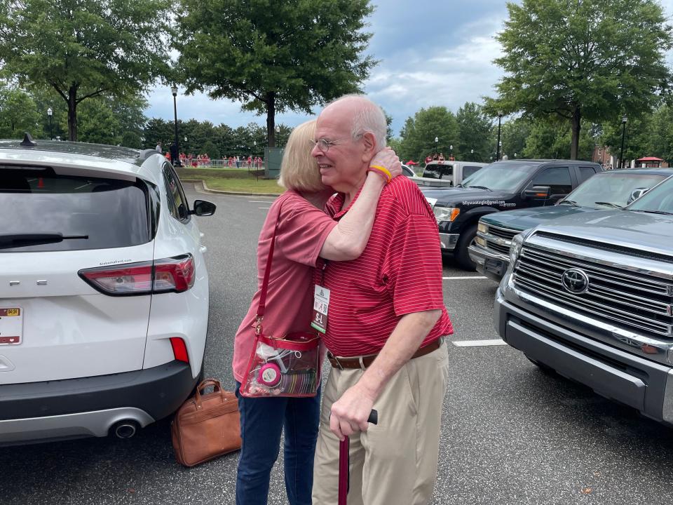 Eli Gold and his wife, Claudette Gold, embrace on Sept. 2 ahead of the Alabama football and Middle Tennessee game.