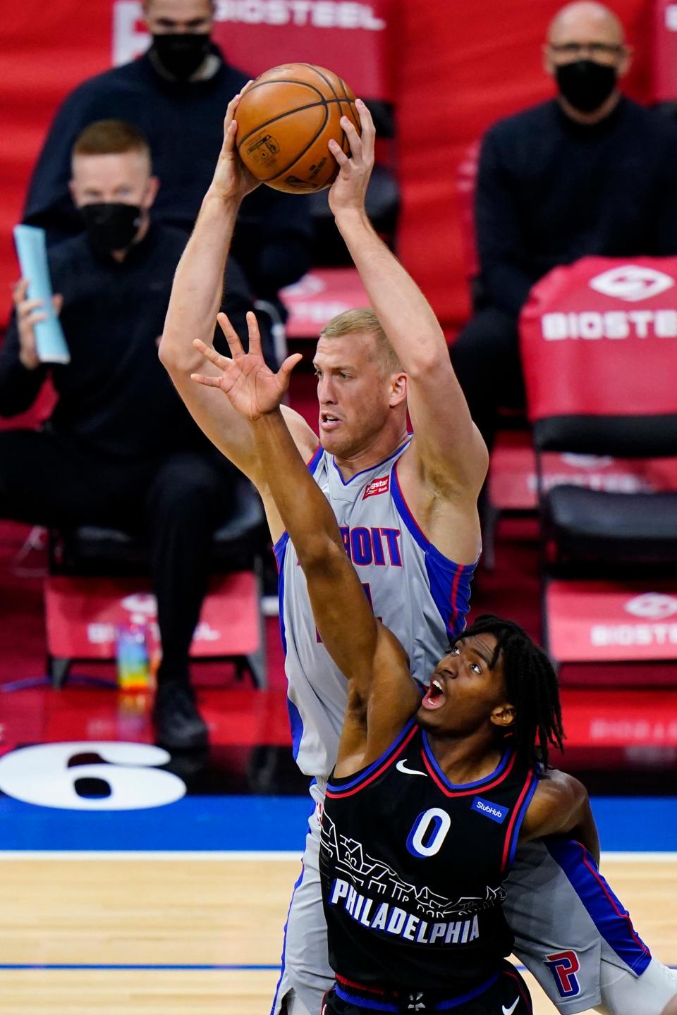 Detroit Pistons' Mason Plumlee, top, and Philadelphia 76ers' Tyrese Maxey leap for a rebound during the first half of an NBA basketball game, Saturday, May 8, 2021, in Philadelphia.