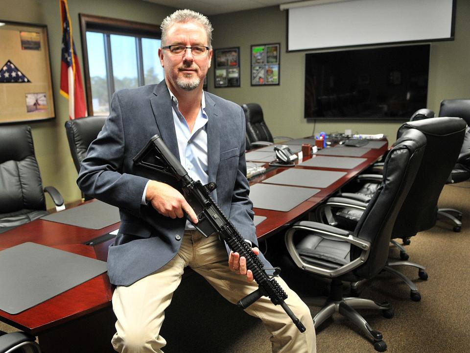 Marty Daniel, head of Daniel Defense, holds the Version 1 of his products at the Bryan County facility.