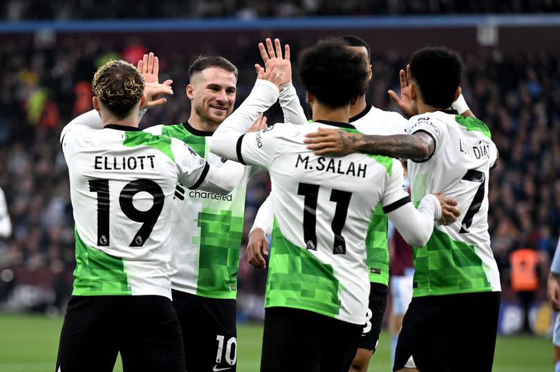 Harvey Elliott celebrates with some Liverpool teammates including Mohamed Salah just after the opening goal against Aston Villa.